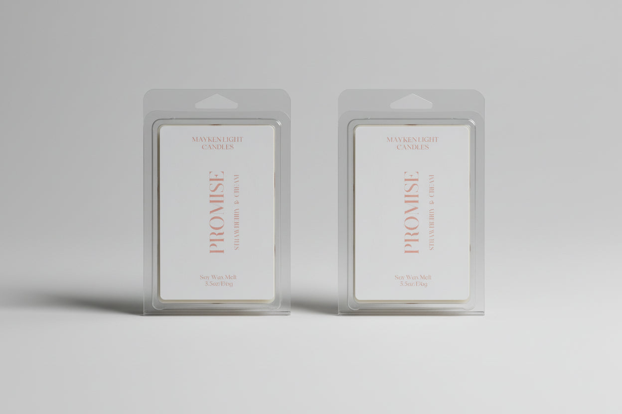 Two 'Promise' wax melt products in clear packaging on a dark surface